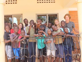 Robbie Palmer- far right- with staff and kids at Kwagala Ministries house for street children in Kampala- Uganda.