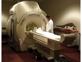 A technician operates an MRI machine. Wait times for MRI scans in the Champlain region remain far above the province's target for non-urgent patients, updated performance indicators show.