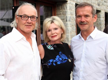 From left, Bernie Normand and Linda Normand with former Canadian astronaut Chris Hadfield at the Hadfield Youth Summit Soirée hosted by Michael Potter on Monday, June 30, 2014, in Rockcliffe Park.