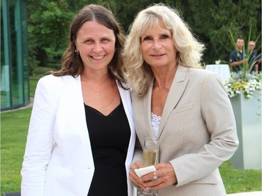 From left, Erin Clatney from DISH Catering with Diane Cramphin at The Hadfield Youth Summit Soirée hosted by Michael Potter at his Rockcliffe Park home on Monday, June 30, 2014.