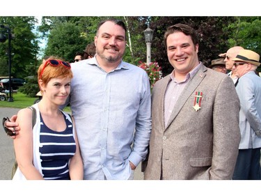 From left, journalist Kady O'Malley with Greg MacEachern and Matt Luloff at the U.S. Embassy's annual Fourth of July party held in Rockcliffe Park on Friday, July 4, 2014.