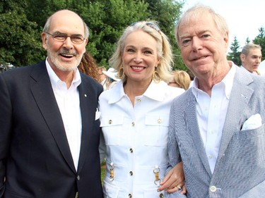 From left, National Arts Centre president and CEO Peter Herrndorf with Shannon Day-Newman and retired CBC broadcaster Don Newman at the annual Independence Day party hosted Friday, July 4, 2014, by the U.S. Embassy at the ambassador's official residence in Rockcliffe Park.