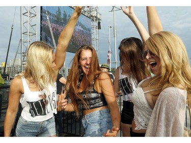 From left:  Sam Tilley, Kate Van Criekengen, Katrina Funk and Amanda Gemmell get down to Danny Brown at Bluesfest opening night Thursday, July 3, 2014.