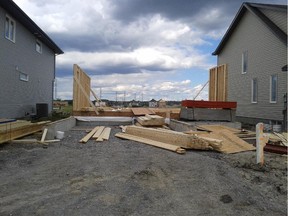 July 4: A scant two days after spotting the lot being backfilled, walls are already starting to go up.