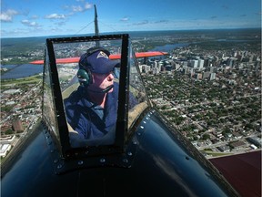 Greg Reynolds pilots his 1940 Waco biplane over Ottawa Thursday.
