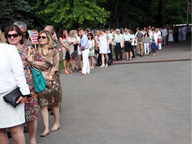 Guests lined up to meet U.S. Ambassador Bruce Heyman and his wife, Vicki, at the Fourth of July party that they hosted at their official residence, Lornado, on Friday, July 4, 2014.