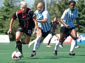 Kristy Moore outruns some members of the Kitchener Waterloo squad.