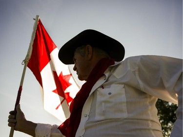 Harry Harder sits on his horse Dotte-Dee-Bar during Canada Day celebrations in Cremona, Alta., Tuesday, July 1, 2014