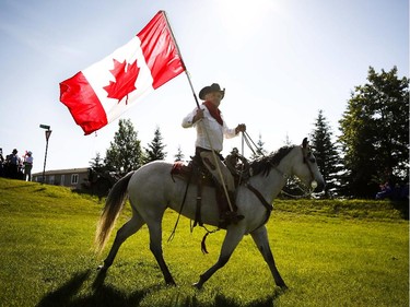 Harry Harder rides his horse Dotte-Dee-Bar during Canada Day celebrations in Cremona, Alta., Tuesday, July 1, 2014.