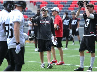 Head coach Rick Campbell issues instructions as the Ottawa Redblacks practice at TD Place Stadium at Lansdowne Park on Monday, July 14, 2014.
