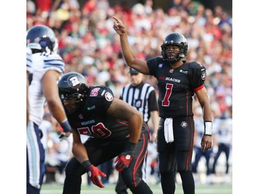 Henry Burris of the Ottawa Redblacks directs his team against Toronto Argonauts at TD Place in Ottawa during the franchise home opener of the Redblacks on Friday, July 18, 2014.