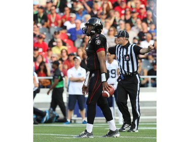 Henry Burris of the Ottawa Redblacks shows his dejection after another offensive flag while in action against the Toronto Argonauts at TD Place in Ottawa during the franchise home opener of the Redblacks on Friday, July 18, 2014.
