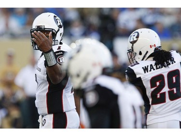 Ottawa Redblacks quarterback Henry Burris (1) signals to his teammates during the first half of CFL action against the Winnipeg Blue Bombers in Winnipeg Thursday, July 3, 2014.