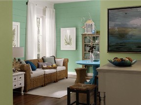The HGTV Home line of paint by Sherwin-Williams includes the Coastal Cool collection. The back wall is Restful (SW 6458), foreground wall is Recycled Glass (SW 7747) and the table is Rapture Blue (SW 6773).