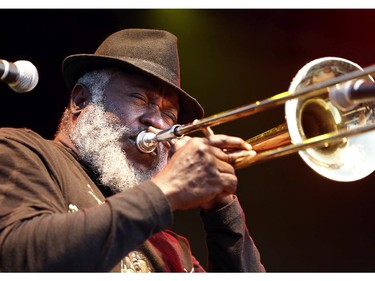 Horn player Nambo Robinson, from Sly and Robbie, play to an appreciative audience on day two of Bluesfest Friday, July 4, 2014 at LeBreton Flats, Ottawa.