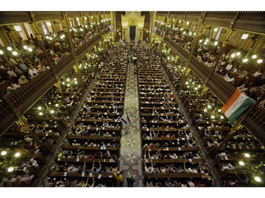 Pro-Israel people listen to Israel's ambassador in Hungary Ilan Mor (not pictured) in Budapest's synagogue on July 27, 2014 during their sympathy demonstration for Israel and to protest against the Hamas' bombs.