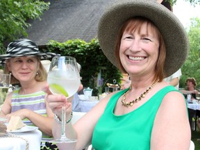 Joan Wilson with one of the water cocktails sold at the charity tea party held Sunday, July 20, 2014, in Plaisance, Que., for the Ryan's Well Foundation, a charity that improves global access to clean water.