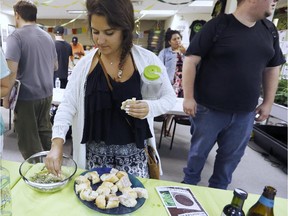 Students taste a cannabis-infused dipping sauce prepared during a cooking class at the New England Grass Roots Institute in Quincy, Mass. The proliferation of marijuana edibles for medical and recreational use in the United States is giving rise to a cottage industry of foods, infused olive oils, cookbooks and classes as more states legalize marijuana use.