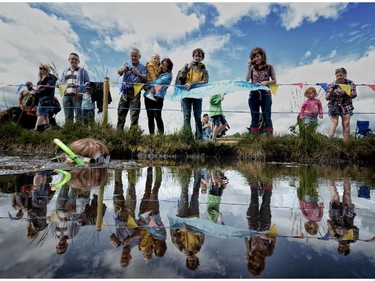 Laura Sherwin takes part in the Irish Bog Snorkelling championship at Peatlands Park on July 27, 2014 in Dungannon, Northern Ireland. The annual event sees male and female competitors swim the 60m length of the bog watched by scores of spectators and takes place on International Bog Day.