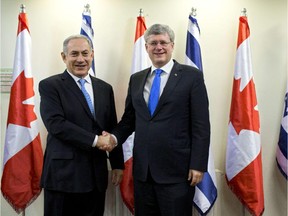 Stephen Harper shakes hands with Israeli Prime Minister Benjamin Netanyahu before their meeting in Jerusalem in January.  Harper's speech to the Knesset won him a standing ovation.