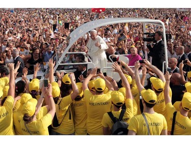Pope Francis greets people gathered at Piazza Carlo III before leading mass during a one-day visit to Caserta, Italy, on July 26, 2014.