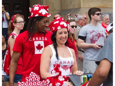 Jamal Carrington and Jill Cook sell soft drinks on Wellington Street as people flock to Parliament Hill and the downtown core to enjoy Canada's 147th birthday.