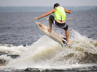 Jeremy Barnett of Burnstown, Ont. catches some air as he competes in the Canadian Wake Surf Nationals in Calabogie Lake Friday July 25, 2014. The premier wake surfing event runs until Sunday.