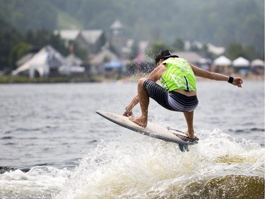 Jeremy Barnett of Burnstown, Ont. catches some air as he competes in the Canadian Wake Surf Nationals in Calabogie Lake Friday July 25, 2014. The premier wake surfing event runs until Sunday.