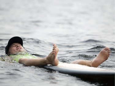 Jeremy Barnett of Burnstown, Ont. tests out the water before competing in the Canadian Wake Surf Nationals in Calabogie Lake Friday July 25, 2014. The premier wake surfing event runs until Sunday.