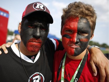 Jimmy D Fata and son Colby Fata put on their game faces well before the Redblacks' home opener kickoff at TD Place on Friday, July 18, 2014.