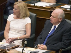 Ontario PC's Interim Leader Jim Wilson (right) sits with leadership candidate Christine Elliott during the Throne Speech at Queens Park in Toronto on Thursday July 3, 2014.