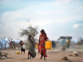 A file photo shows Somali refugees fetching water at Ifo-extension in Dadaab, Kenya.