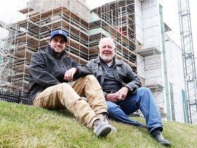 Kevin Tovee (L), apprentice stone mason, and Bobby Watt, President of RJW-Gem Campbell Stonemasons sit in front of one of their current projects, April 29, 2014.