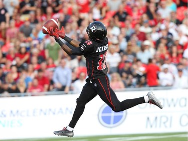 Kierrie Johnson of the Ottawa Redblacks misses a great throw against the Toronto Argonauts at TD Place in Ottawa during the franchise home opener of the Redblacks on Friday, July 18, 2014.