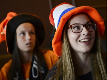 Katie Sloan, left, and Abby Sypes cheering for Netherlands watch the FIFA World Cup 2014 match between Netherlands and Argentina at Hooley's on Wednesday, July 9, 2014.