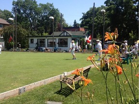 Lawn bowlers play on the manicured lawns of Highland Park Lawn Bowling Club during Saturday's 100th anniversary celebrations.