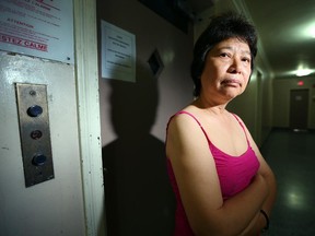 Lili Weemen stands in front of the long-broken broken elevator at her Metcalfe Street apartment building.