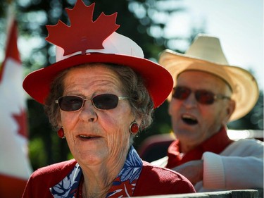 Lita Reid, left and her husband Allan show their Canadian pride during Canada Day celebrations in Cremona, Alta., Tuesday, July 1, 2014.