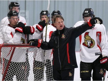 Skating coach Marc Power, middle, gives instructions to the Ottawa Senators' NHL prospects during their annual development camp at the Bell Sensplex on Friday, July 4, 2014.