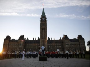 Massed military bands, along with The Band of the Ceremonial Guard, rehearse on Wednesday evening, July 23, 2014 for the 18th annual Fortissimo – a free military and musical performance – on Parliament Hill, which will take place from Thursday to Saturday, starting at 7:30 p.m. each night.