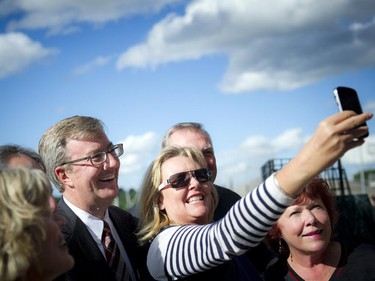 Mayor Jim Watson takes a selfie with Ottawa city councillors at the official opening of TD Place at Lansdowne Wednesday July 9. 2014.