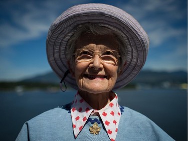 Megan Balmer wears a maple leaf pin and a shirt covered with maple leafs as she poses for a photograph while attending Canada Day celebrations in Vancouver, B.C., on Tuesday July 1, 2014.