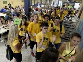 Members of Team Manitoba cheer as they arrive for dinner on the eve of the opening of the Jeux de la Francophonie Canadienne in in Gatineau on Tuesday. About 1,200 participants, 750 volunteers and as many as 20,000 spectators are expected.