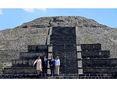 The Prime minister of Japan Shinzo Abe(2L) and his wife Akie Abe(L) pose with Mexican President Enrique Pena Nieto(2R) and his wife Angelica Rivera during a visit to Teotihuacan, Mexico State on July 26, 2014.  Japanese Prime Minister struck a series of energy deals Friday with Mexican President Enrique Pena Nieto at the start of a five-country Latin American tour.