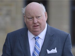 Mike Duffy arrives to the Senate on Parliament Hill in Ottawa, Monday, Oct. 28, 2013.