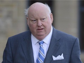 Sen. Mike Duffy arrives to the Senate on Parliament Hill in Ottawa, Monday, October 28, 2013.