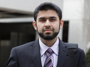 Misbahuddin Ahmed (right) exits the Elgin St. courthouse with lawyer Mark Ertel after the completion of jury selection in Ottawa, Monday, May 12, 2014. Ahmed was arrested in August 2010 on terrorism charges. His trial starts Wednesday at 10am in courtroom 34. Twelve jurors and two alternates were selected. Mike Carroccetto / Ottawa Citizen  NEG# 117049