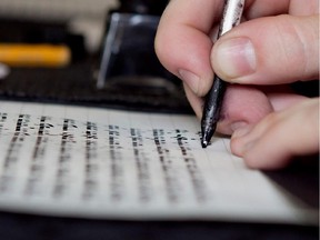 Jen Taylor Friedman writes a Torah by hand in her home in Montreal.
