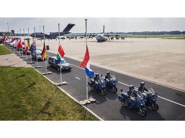 Hearses carrying the coffins with the remains of the victims of the Malaysian Airlines MH17 plane crash leave Eindhoven military airport on July 26, 2014. It is the fourth day that Dutch and Australian transport planes have been bringing the remains from Kharkiv to the Netherlands, where the identification process will take place. Malaysia Airlines Boeing 777 flight MH17 with more than 280 passengers, including 194 Dutch passengers, crashed in eastern Ukraine on July 17.