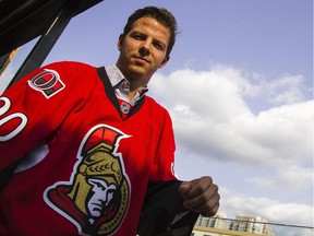 New Ottawa Senator Alex Chiasson poses for pictures in a Senators jersey for the first time during a ceremonial grand opening of Sens House, the official sports bar of the Ottawa Senators, in the Byward Market.